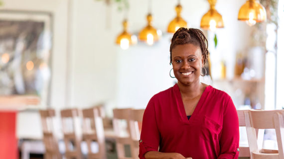 Angela Fitzgerald is seated in the Madison restaurant Julep