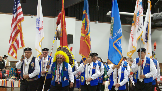 The honor guard enters with the U.S. flag and others at the Comanche Indian Veterans Association Celebration and Powwow