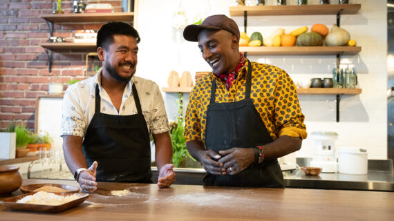 Two men cooking