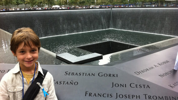 A child stands in front of the Sept. 11 memorial pool in New York City.