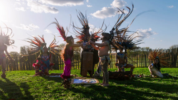 A Native American ceremony in full Indigenous dress