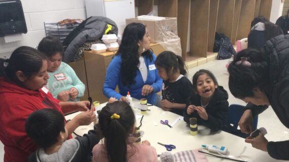 Families doing an activity at a table