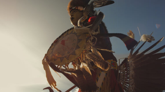 Native American dancer in traditional dress.