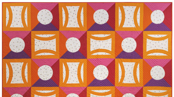 "Loops, Lines & Dimensions," an orange, pink, purple, white and red Double Wedding Ring quilt by Victoria Findlay Wolfe.