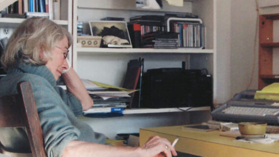 Be ‘cringe’ with me in reverence for Mary Oliver Mary Oliver seated in profile at a cluttered home desk, resting her head on one hand while looking down at a typewriter, shelves of books and CDs behind her